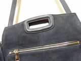 a black purse with a gold zipper on it
