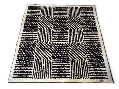 a black and white rug with a pattern on it
