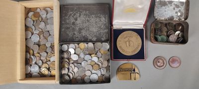 a lot of coins in a box on the table