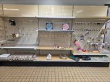 a display case with many items on it in a store
