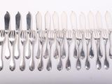 a lot of forks and spoons that are on the table