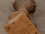 a piece of wood that is laying on the floor