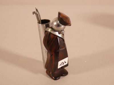 a figurine of a man holding a spoon and a cup