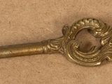 an old key that is sitting on a table