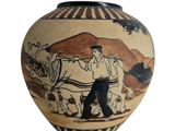 un vase sur lequel est représenté un homme et un cheval