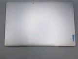 a laptop computer sitting on top of a white table