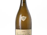 bottle of white wine on a white surface with a white background