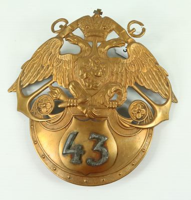 an image of a gold plate with an eagle on top of it
