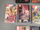 a lot of nintendo wii games on the table