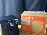 a close up of a box and a coffee maker on a table