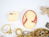 a lot of jewelry on a white surface