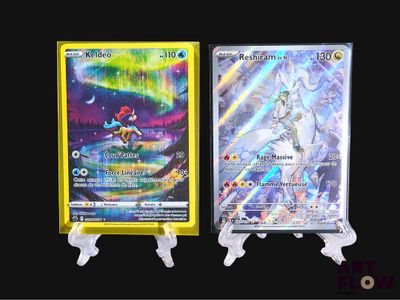 two pokemon cards are displayed on a stand in front of a black background