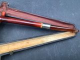 two different types of smoking pipes in a case