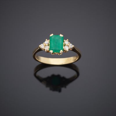 an emerald and diamond ring
