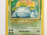 a close up of a pokemon card on a white surface