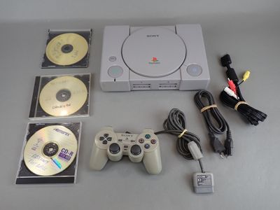 a video game system with two controllers and a game disc