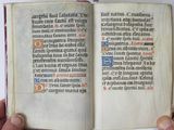 a person holding an open book in their hands