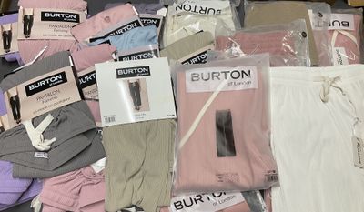 a pile of clothing that is sitting on a table