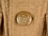 a close up of a coat with a button on it