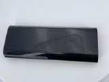 a black purse sitting on top of a white table