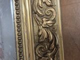 a picture of a gold frame with a picture in it