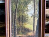 an image of a painting of a wooded path in a wood frame