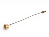 a close up of a metal pin with a flower on it