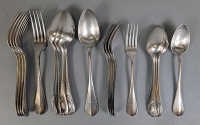 five silver spoons and six silver spoons on a table