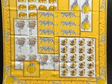 a yellow banda with pictures of animals and people on it