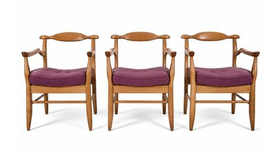 three wooden chairs with purple upholstered cushions on a white background