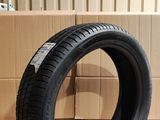 a close up of a tire on a cardboard box in a warehouse