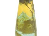 a vase with a mountain scene painted on it