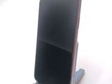 a cell phone that is sitting on a stand