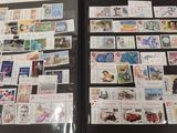 a lot of stamps on the pages of a book