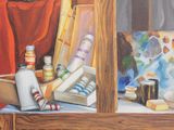 a painting on a table with a painting easel and other art supplies