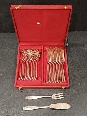 a red case with silverware in it on a table