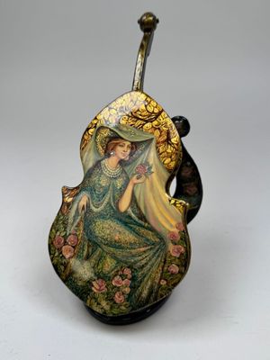 an image of a decorative vase with a woman on it