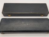 pair of black leather cases with monogrammed initials on them