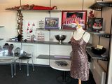 a dress on a mannequin stand in the corner of a room