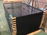 a large stack of pallets sitting in a warehouse