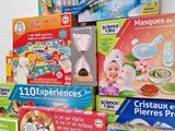 several children ' s board games are stacked on top of each other