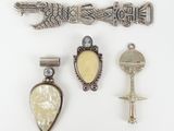 three silver and mother of pearl brooches and a silver and mother of pearl brooch