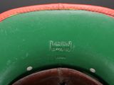 underside view of a green and red baseball cap with a brown brimle