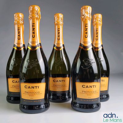 four bottles of canti champagne are lined up in a row