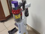 a vacuum that is sitting on the floor next to a door