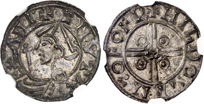 a close up of two silver coins on a white surface