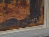 a cat sitting on a window sill in front of a painting