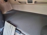 a keyboard and mouse on the seat of a car