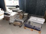 a pile of boxes and boxes on pallets in a warehouse
