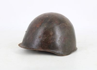 a close up of a helmet on a white surface